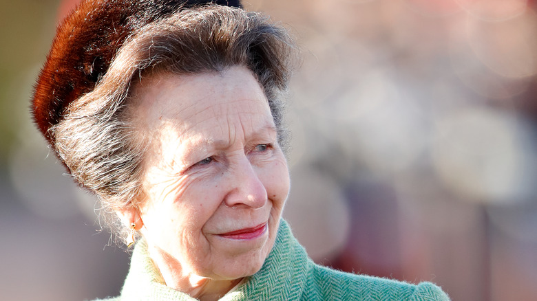 Princess Anne wearing a fur hat and green coat 