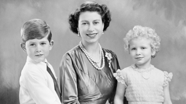 Queen Elizabeth with young Charles and Anne 