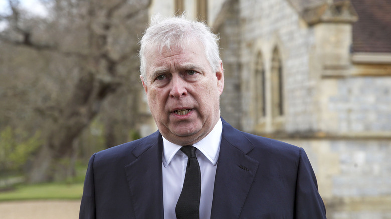 Prince Andrew outside a chapel