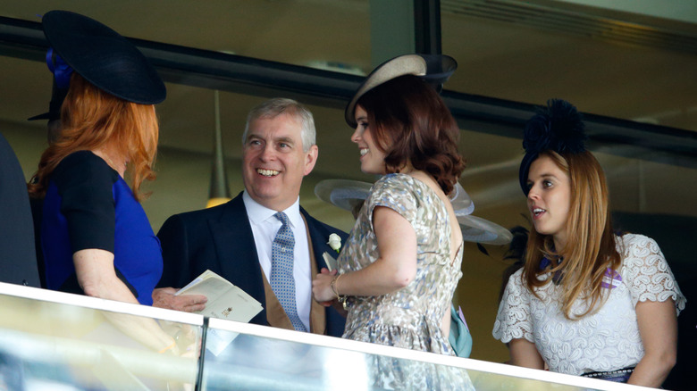 Prince Andrew, Sarah Ferguson, Princess Beatrice, and Princess Eugenie watching horse racing