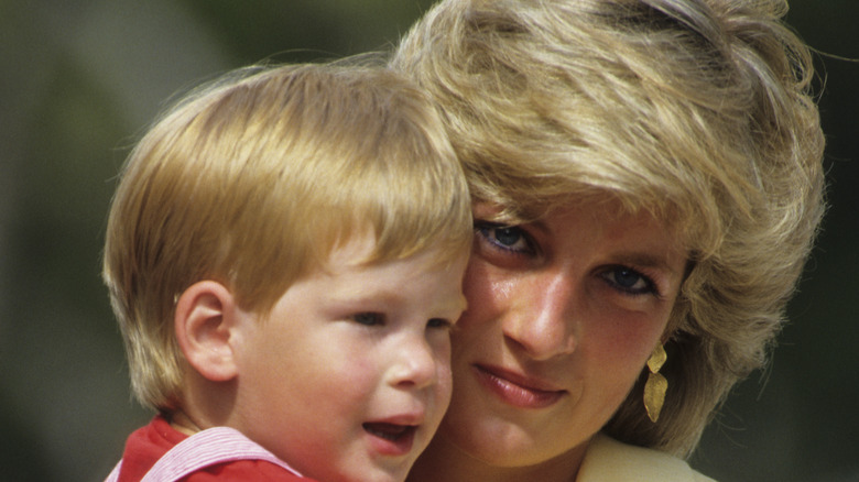 Princess Diana holding Prince Harry