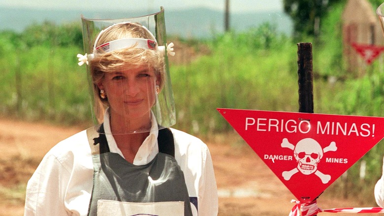 Princess Diana in body armor walking in minefields 