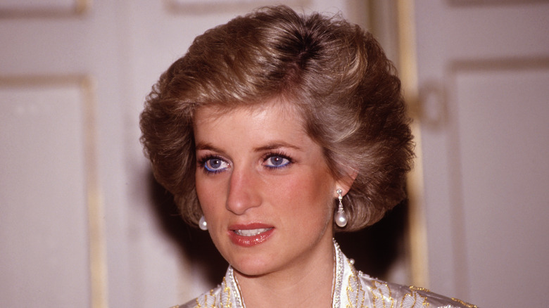 Princess Diana wearing gold and white