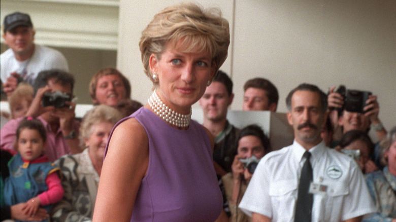 Princess Diana wearing pearls at an event 