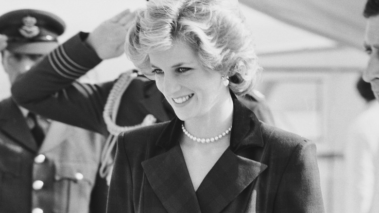 Princess Diana smiling in black and white