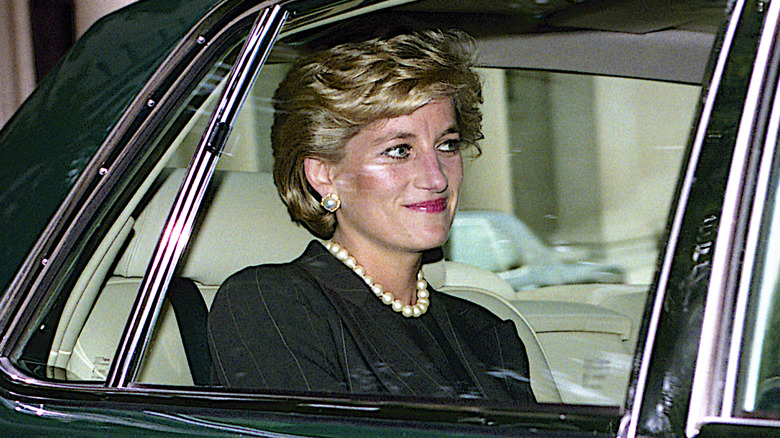 Princess Diana riding a car