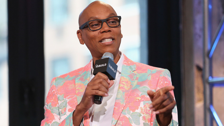 RuPaul's Drag Race host RuPaul Charles explaining something