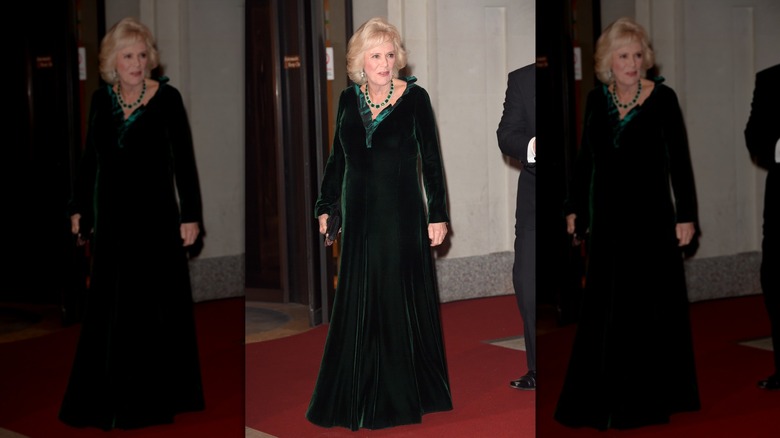 Queen Camilla wearing a green gown 