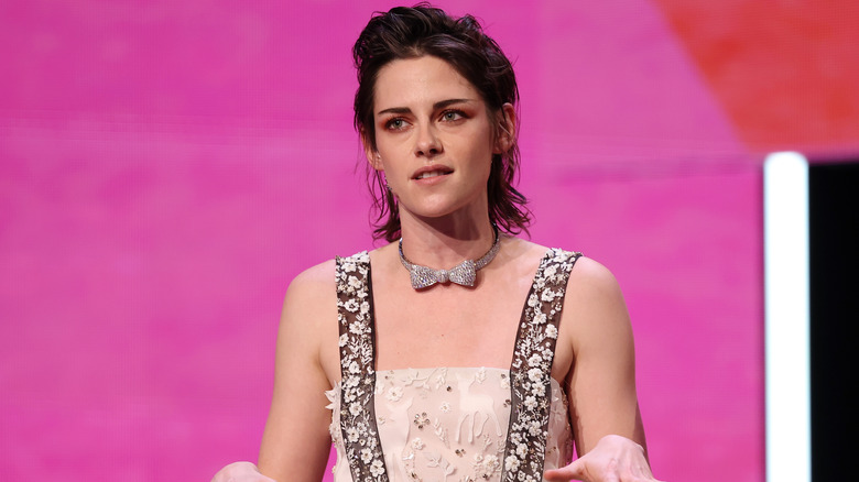 Kristen Stewart speaking, hands outstretched