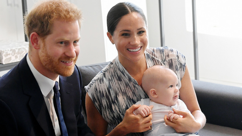 Harry, Meghan, and Archie smiling