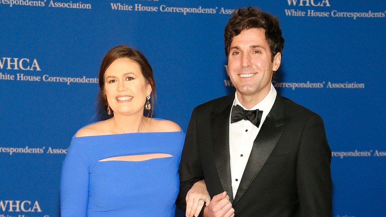 Sarah Huckabee Sanders smiling with husband