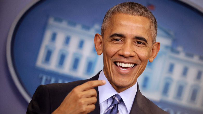 Barack Obama smiling and pointing