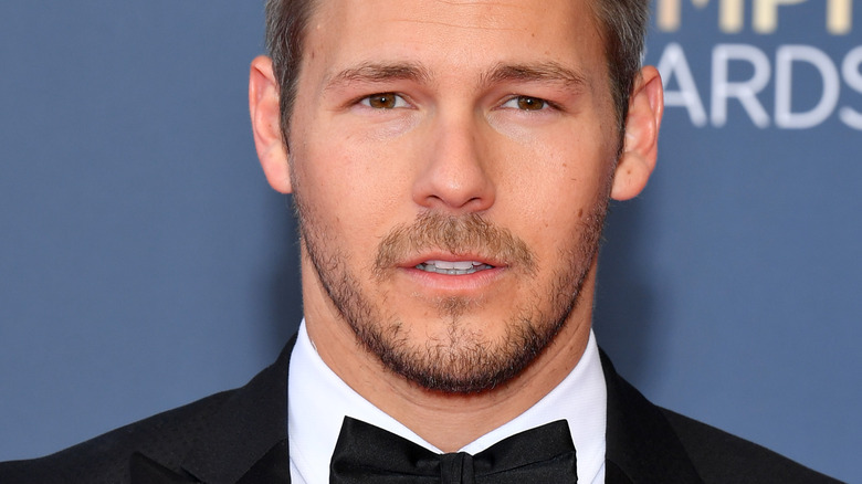 Scott Clifton with serious expression on the red carpet