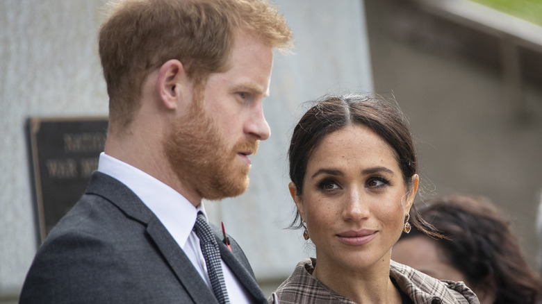 Meghan Markle looking sideways at Prince Harry