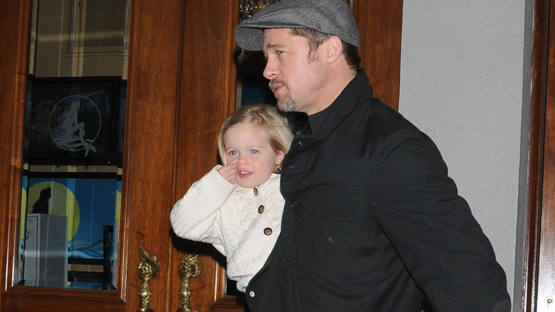 Brad Pitt holding toddler Shiloh Jolie-Pitt 