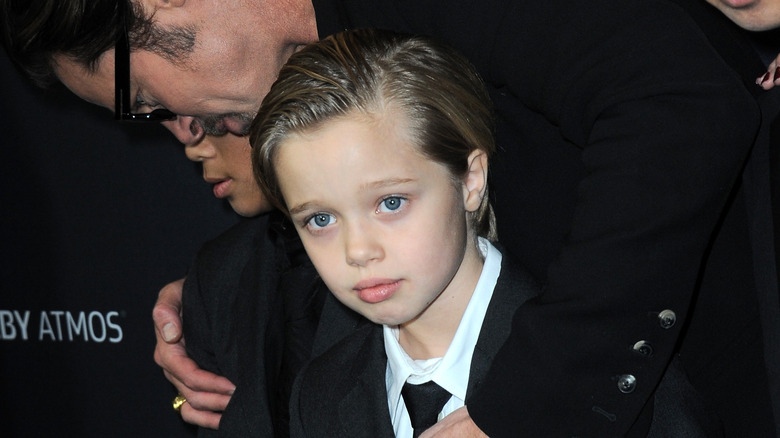 Shiloh Jolie-Pitt posing