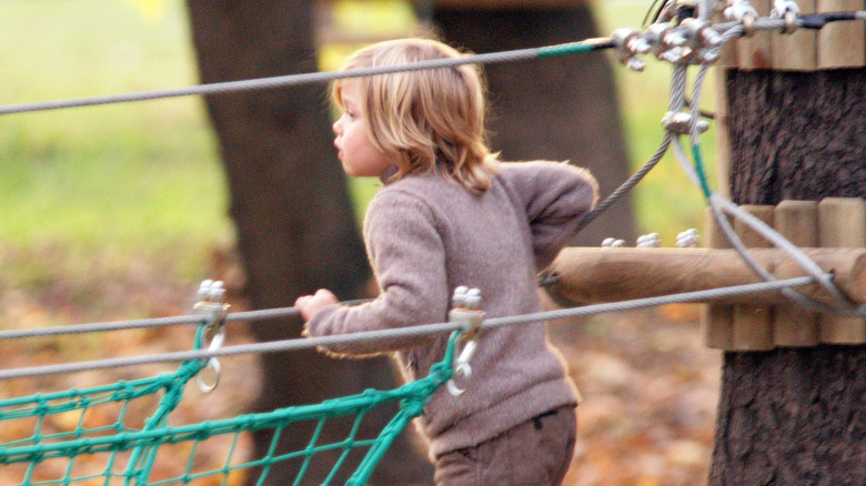 Toddler Shiloh Jolie-Pitt at a park