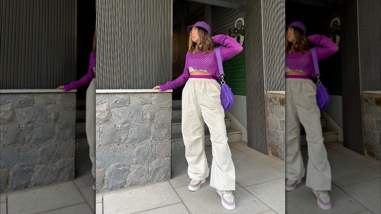 Beige parachute pants, purple top