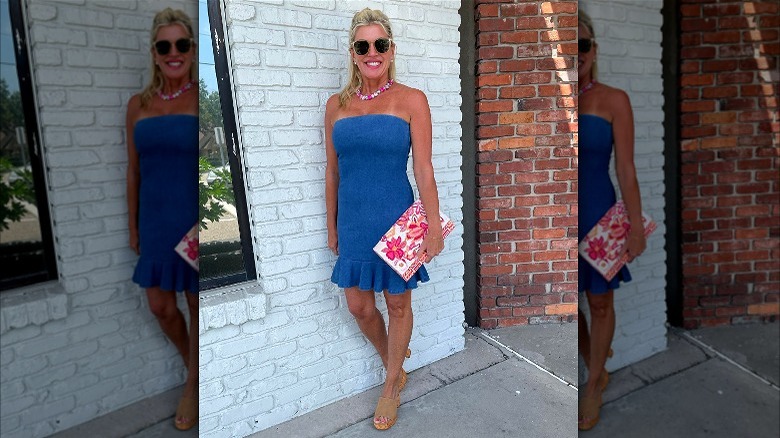 woman posing in blue strapless dress