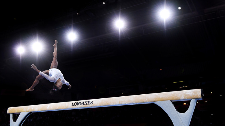 Simone Biles competing in gymnastics 