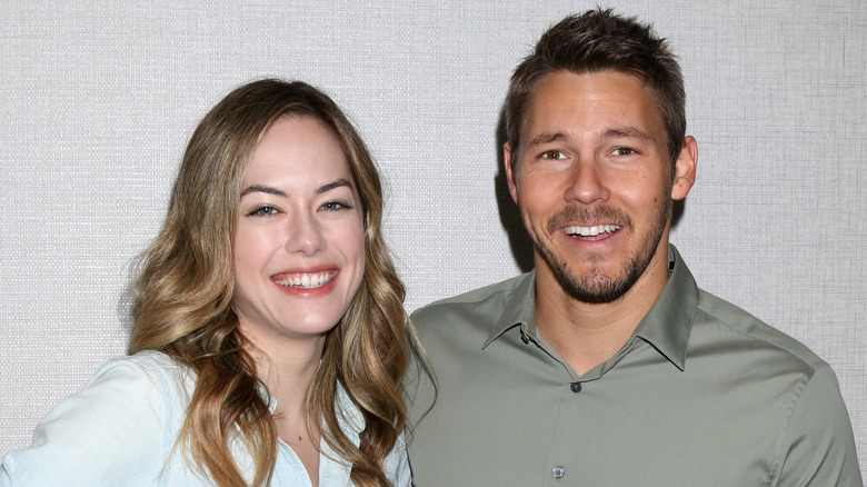 Annika Noelle and Scott Clifton pose on the red carpet