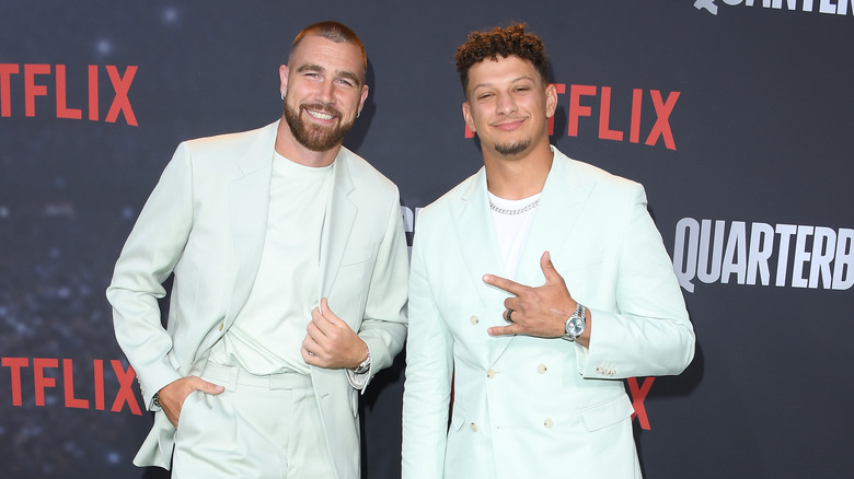 Patrick Mahomes and Travis Kelce in matching suits