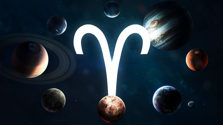 The zodiac sign of Aries surrounded by planets. 