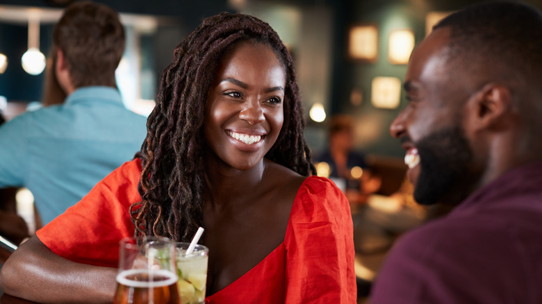 a woman flirting at a bar