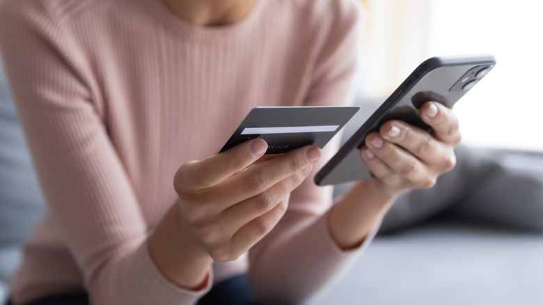 Woman holding credit card