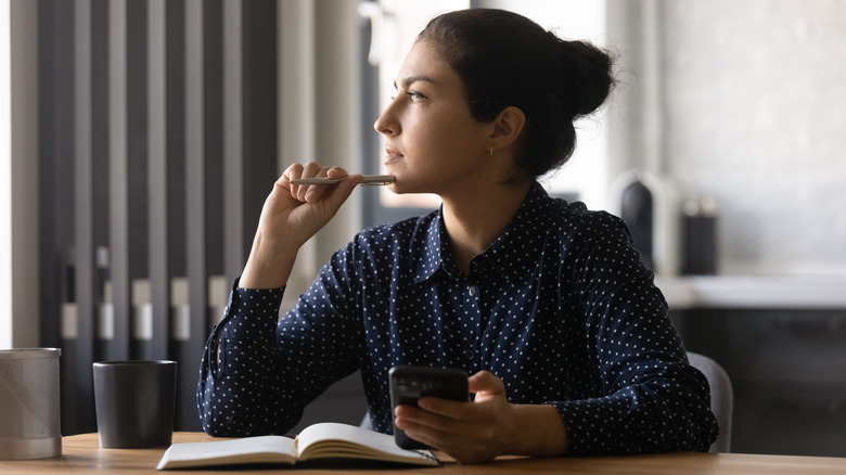 A woman reflecting. 