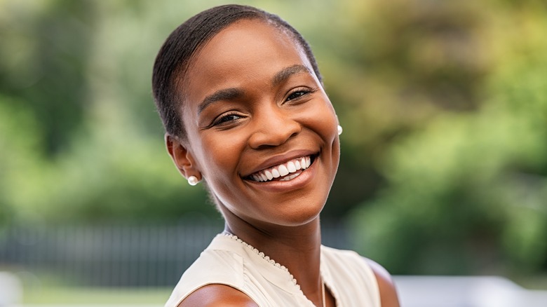 A woman smiling. 