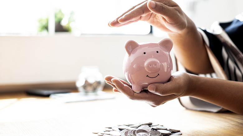 Woman holding piggy bank 