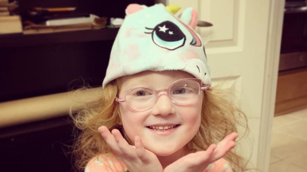 Hazel Busby from OutDaughtered wearing a hat