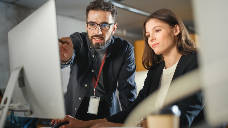 colleagues working at computer