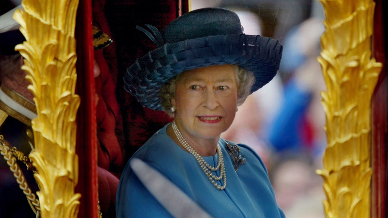 Queen Elizabeth riding in golden state carriage in 2002