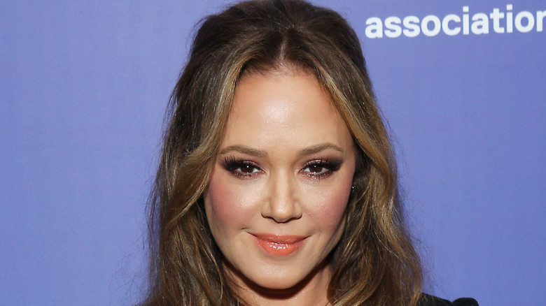 Leah Remini smiles at an event