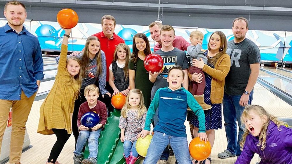 The Duggar kids and their children at a bowling alley