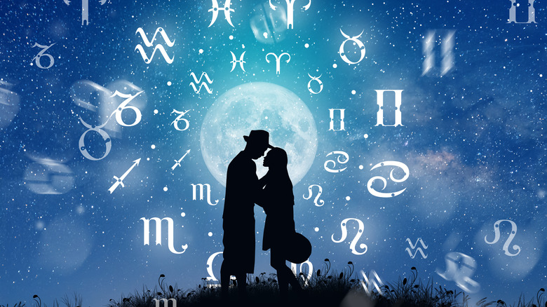 Zodiac signs with full moon and couple embracing 