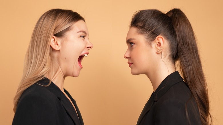 A woman yelling at another 