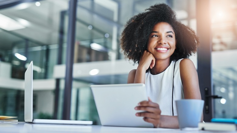 A woman smiling at work