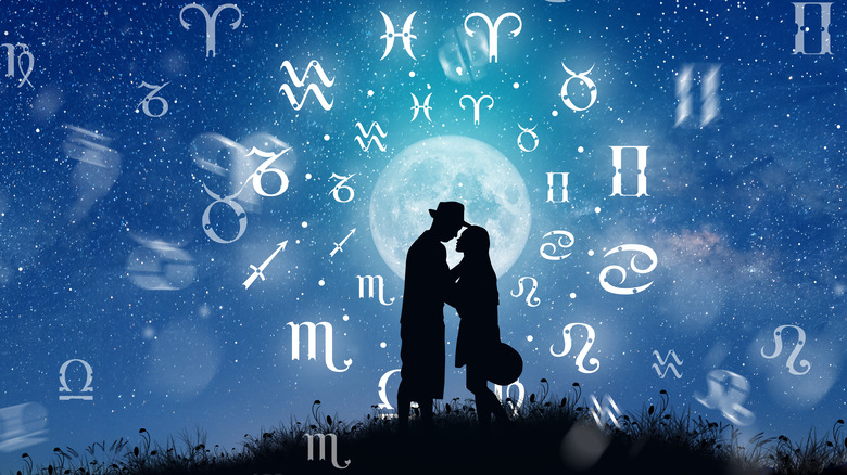 A couple surrounded by zodiac signs.  