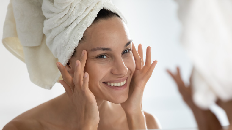 A woman massaging her face