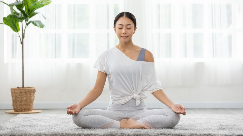 Woman meditating during yoga 