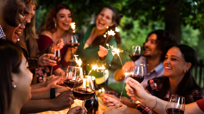 A group of people enjoying dinner together. 