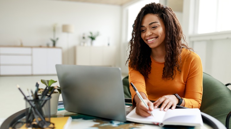 A woman working at her computer. 