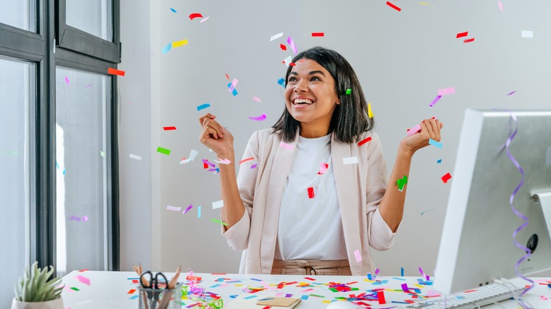 woman celebrating birthday at desk 