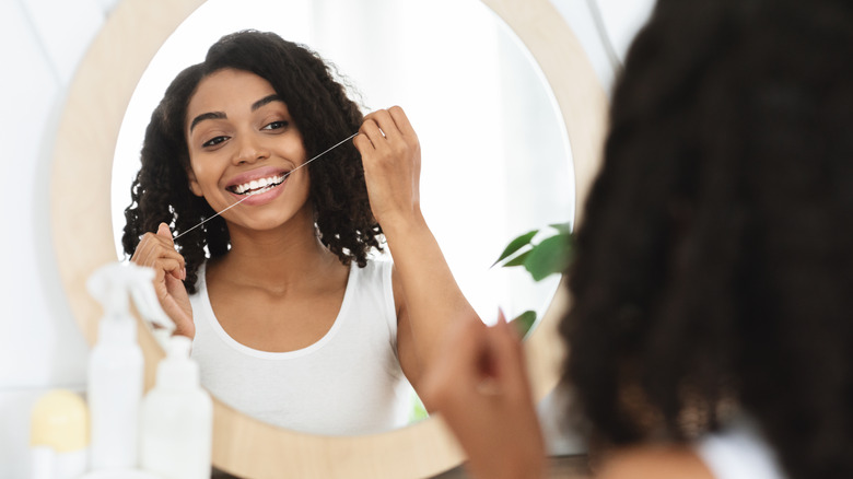 A woman performing self-care. 