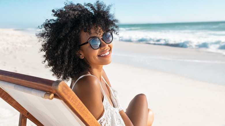 Woman smiling on the beach 