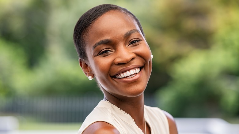 A woman with a big smile on her face. 