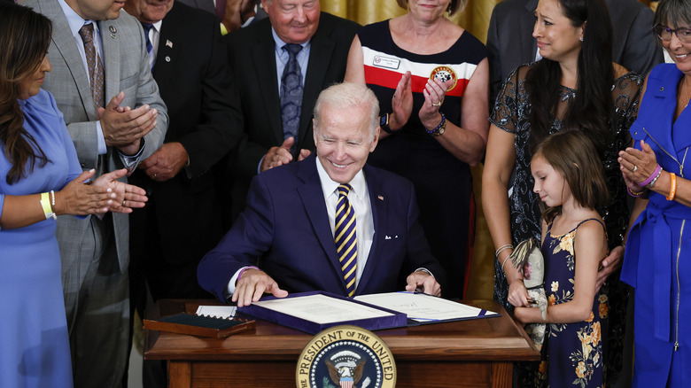 Joe Biden signing the PACT act